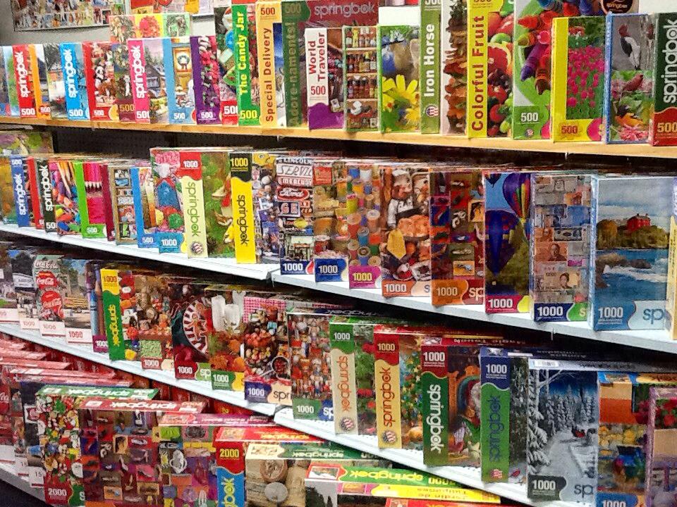 Shelves filled with colorful jigsaw puzzles